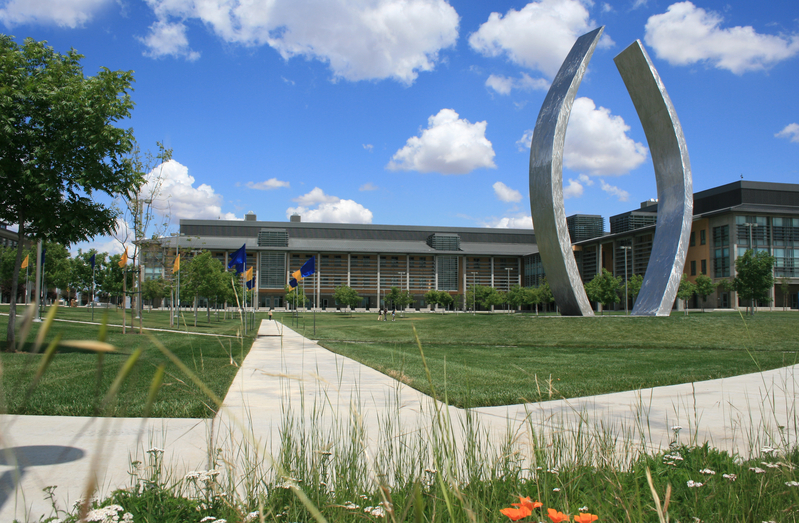 Campus shot of Science and Engineering Building 1 and Beginnings statue
